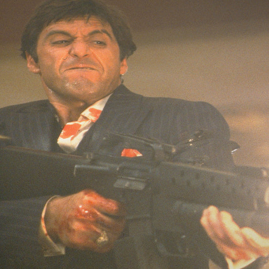 Tony Montana Unleashing “The Little Friend” in the Throne Room